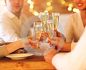 Champagne glasses in people hands