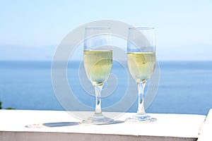 Champagne glasses with sea background