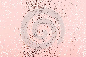 Champagne gold confetti on pink background