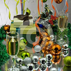 Champagne and new year decorations on golden background