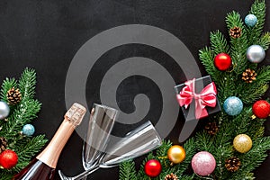 Champagne for New Year`s Eve on black background top view frame copy space