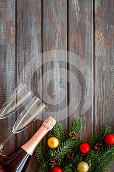 Champagne for New Year`s Eve on dark wooden background top view frame copy space