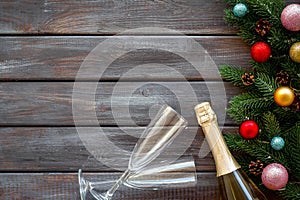 Champagne for New Year`s Eve on dark wooden background top view frame copy space