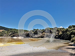 The Champagne Pools in Rotorua spew out hot smoke. This is a popular tourist destination