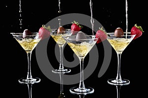 Champagne Pouring Onto Chocolate Truffles With Strawberries