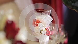 Champagne pouring in two glasses from a bottle. Two Champagne Glass On Defocused. Bottle