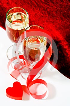 Champagne with red ribbon and heart