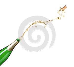 Champagne splashing out of bottle on background