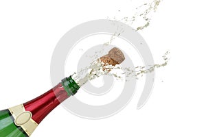 Champagne splashing out of the bottle on New Year's Eve or party
