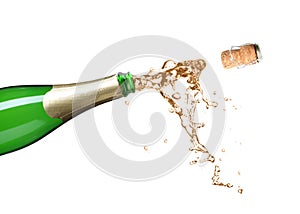 Champagne splashing out of bottle on background