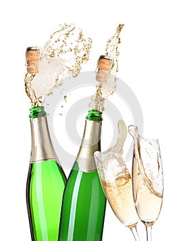 Champagne splashing out of bottles and glasses on background