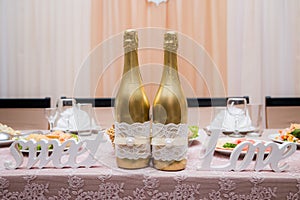 Champagne to the newlyweds on the table