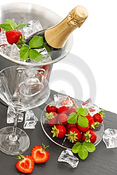 Champagne, two glasses and strawberries