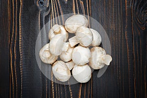 Champignon mushroom on wooden background