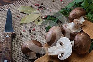 Champignon mushrooms on wooden background