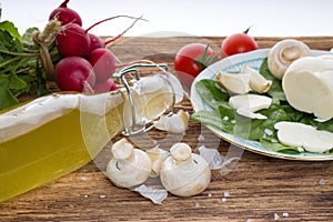 Champignons and various vegetable with coarse-grained salt around