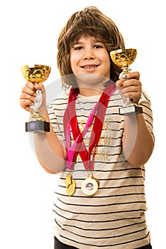 Champion boy showing his trophies