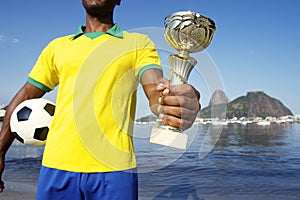 Champion Brazilian Soccer Player Holding Trophy and Football