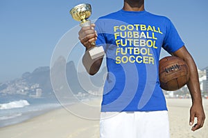Champion Brazilian Soccer Player Holding Trophy and Soccer Ball photo