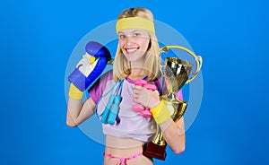 Champion concept. Girl successful modern woman hold golden goblet of champion. Woman good in tennis jumping boxing