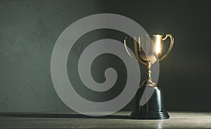 Champion golden trophy placed on wooden table