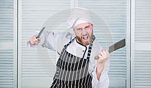 He is a champion in the kitchen. angry bearded man with knife. love food. cook in restaurant. chef ready for cooking