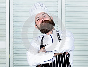 He is champion in the kitchen. Confident bearded strong chef white uniform. Become chef at restaurant. Professional chef