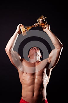 Champion lifting up his cup