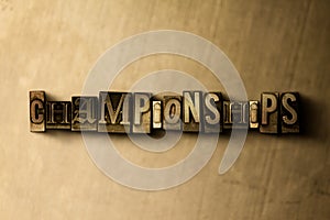 CHAMPIONSHIPS - close-up of grungy vintage typeset word on metal backdrop