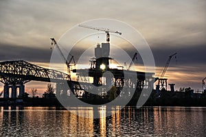Bridge construction at sunset