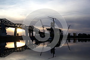 Bridge construction at sunset