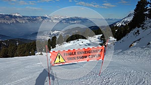 Chamrousse january 2017 : thin snow cover sign on top of the ski slope