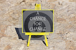 A chance for change symbol. Concept words A chance for change on beautiful black chalk blackboard. Beautiful stone background.