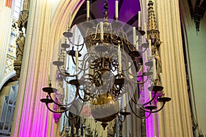 Chandelier with candles in the cathedral of Den Bosch