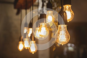 Chandelier with edison lamps in a dark room