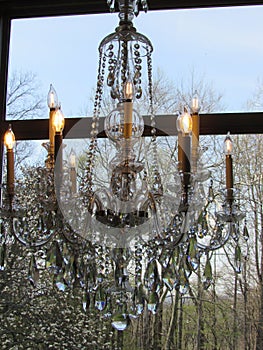 Chandelier fronts a Spring window scape