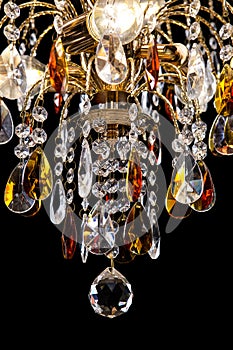 Chandelier for interior of the living room. chandelier details isolated on black background.