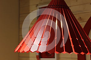 Chandeliers made of red lacquered wood panels