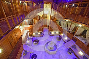 Chanderlier on entrance with fountain to the rest area of typical Turkish Hammam Bath at Istanbul, Turkey