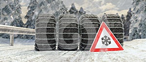 change a car tires from summer for winter, danger sign on the snow road