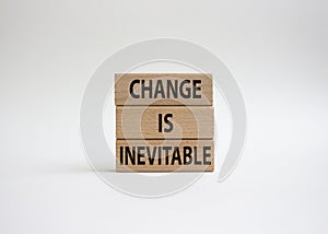 Change is Inevitable symbol. Wooden blocks with words Change is Inevitable. Beautiful white background. Business and Change is