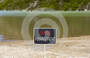 Change management symbol. Concept words Change management on beautiful black blackboard. Beautiful mountain lake background.