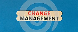 Change management symbol. Concept words Change management on beautiful wooden stick. Beautiful blue table blue background.