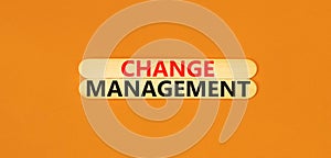 Change management symbol. Concept words Change management on beautiful wooden stick. Beautiful orange table orange background.