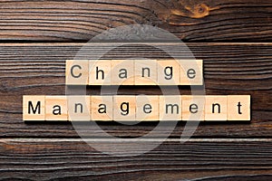 Change management word written on wood block. change management text on table, concept