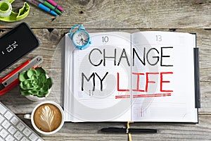 Change my life, personal goal or resolution for the new year handwritten on agenda