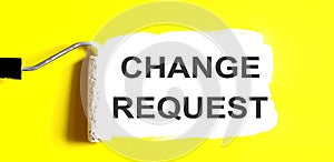 CHANGE REQUEST One open can of paint with white brush on it on yellow background. Top view