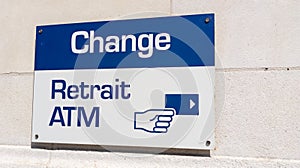 Change retrait atm means in french exchange money office and square shape ATM sign in wall bank agency