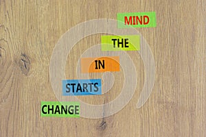 Change starts in the mind symbol. Concept words Change starts in the mind on colored paper on a beautiful wooden table wooden