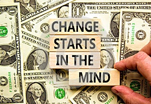 Change starts in the mind symbol. Concept words Change starts in the mind on wooden blocks on a beautiful background from dollar
